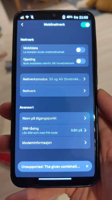 A hand holding a oneplus 6t running postmarketos in the mobile settings menu