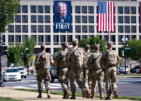 The same picture as above, but taken from a distance, with American troops walking in front of it.