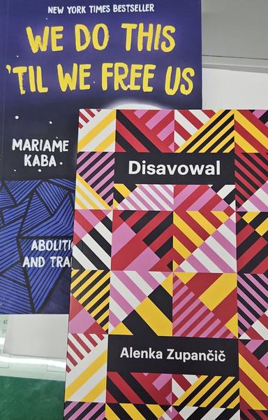 a photo of two books: Mariame Kaba's We Do This 'til We Free Us, and Alenka Zupančič's Disavowal.
