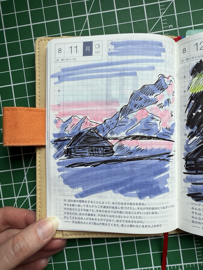 A sketchbook page of a snowy mountainous landscape bathed in pastel light