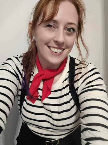 A woman posing for a selfie dressed as Maelle from Expedition 33.