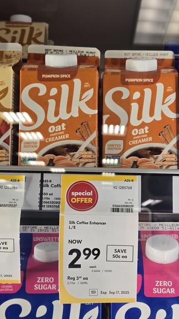 Photo of cartons of Silk brand oat creamer in special limiged edition fall flavors in the dairy section of Sobeys, a Canadian grocery chain. The price sticker hanging below off the shelf says, Special Offer, Now 2.99.
The flavor shown here is Pumpkin Spice, with a burnt orange carton.