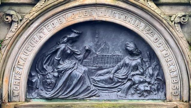 A relief sculpture showing two female figures on a Victorian fountain in Glasgow.