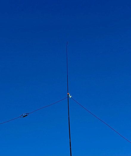 The closed link of a wire antenna attached to the top of a pole