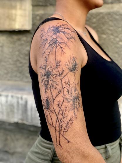 Tattoo of nigellas on an arm