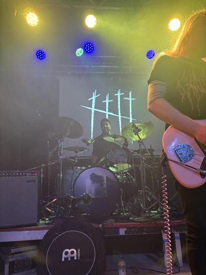 Drummer Mitchell spotting me as I take his photo