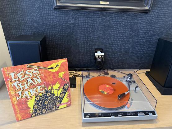 Picture of Anthem by Less Than Jake next to a record player.
