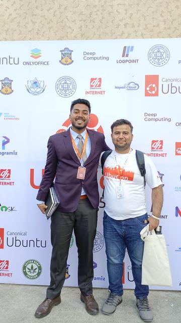 Aaditya Singh (Left) and me (Mazhar Hussai, Right) Standing infront of UbuCon sponsors board.