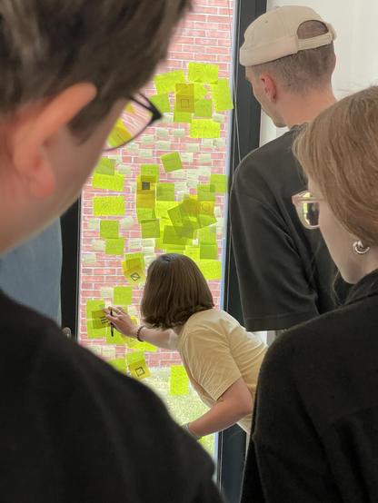 Me hanging postits onto a window