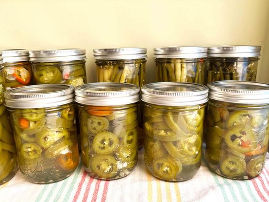 Jars of spicy dill beans and jalapenos