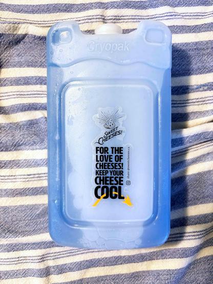 A gel ice pack from Sweet Cheeses it says "For the love of cheeses! Keep your cheese cool"