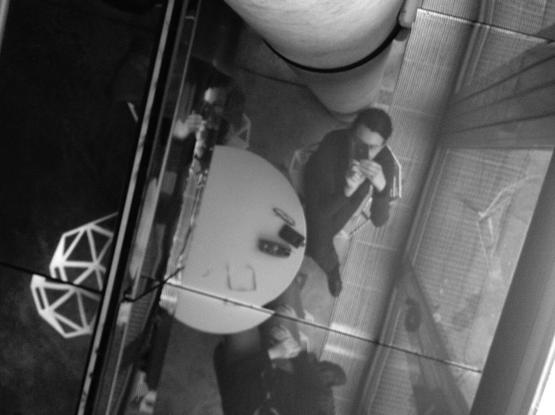 Self-portrait of the photographer in the ceiling window of the café at the Musée du Quai Branly in Paris. (Version françæ) Autoportrait dal photographe dans læ vitre dal plafond dal café dal musée dal Quai Branly à Paris.