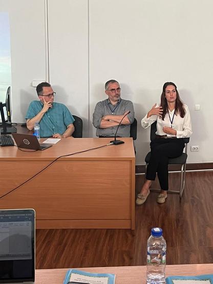 Three researchers at the conference panel on Mongol Intellectual History: from left to right, Stefan Kamola, Bruno De Nicola, and Carina Dreyer, who is speaking and gesturing with her hands.
