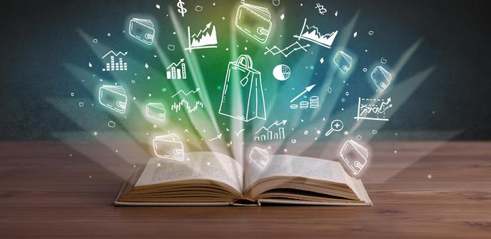 image of an open book with shining light coming from the pages and within the light are images of growth graphs, wallets, purses, and dollar signs