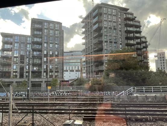 construction side of standard boring mid-size skyscrapers, seen from the train window