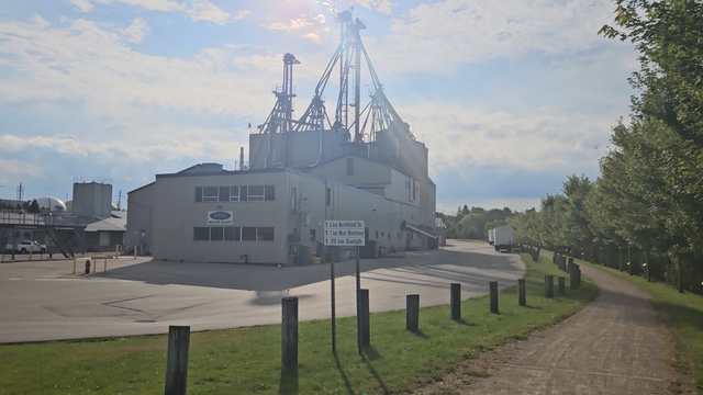 a rail trail besides a mixing factory