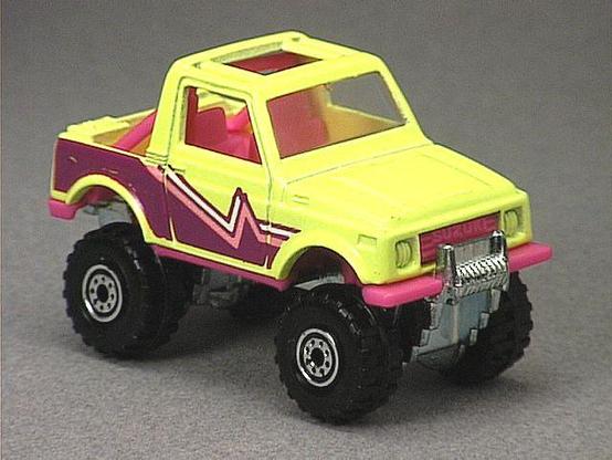 Released in 1993, Fluorescent Yellow Street Roader of 1993 with Construction Tire wheels. Tampo: Pink, magenta, and white on sides. Packaging: Hot Wheels Video. Metal Body, Metal Base. Made in Malaysia. Scarcity: 3/10