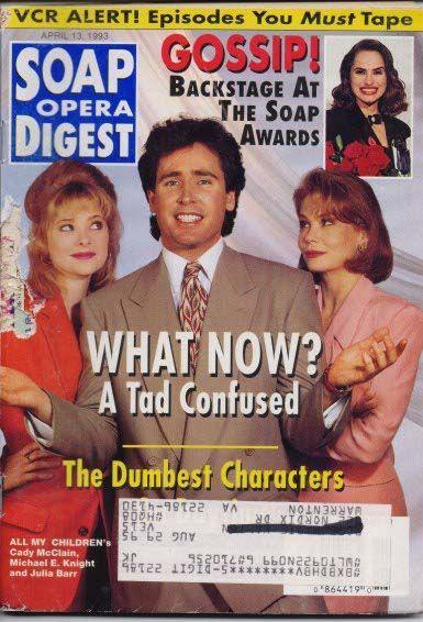 Cover of Soap Opera Digest – April 13, 1993, featuring actors Cady McClain, Michael E. Knight, and Julia Barr from All My Children, dressed in formal attire. The main headline reads “WHAT NOW? A Tad Confused,” with additional teasers including “The Dumbest Characters” and “GOSSIP! Backstage At The Soap Awards.” The layout blends humor, intrigue, and behind-the-scenes allure, reflecting the magazine’s biweekly rhythm and its coverage of both on-screen drama and off-screen personalities. A barcode and mailing label appear at the bottom.
