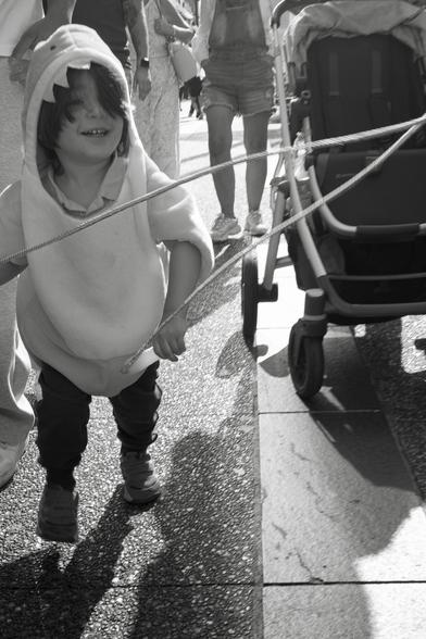 A child in a shark costume attacks Granville Street.