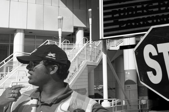 A traffic cop guides a vehicle that is going the wrong way.