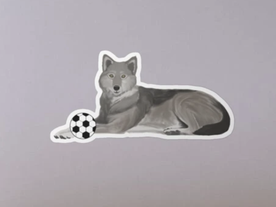 Our wolf mascot is playing soccer.
