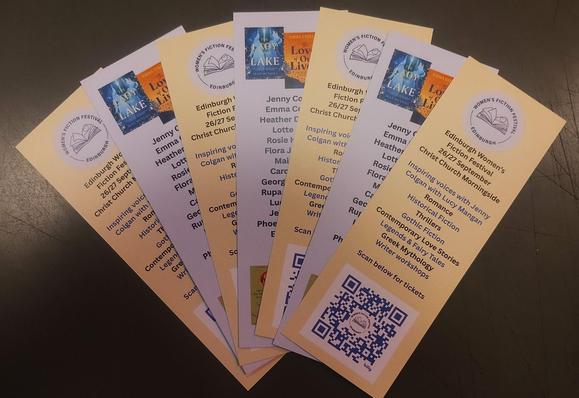 bookmarks for the Edinburgh Womens Fiction Festival, fanned out on a desk