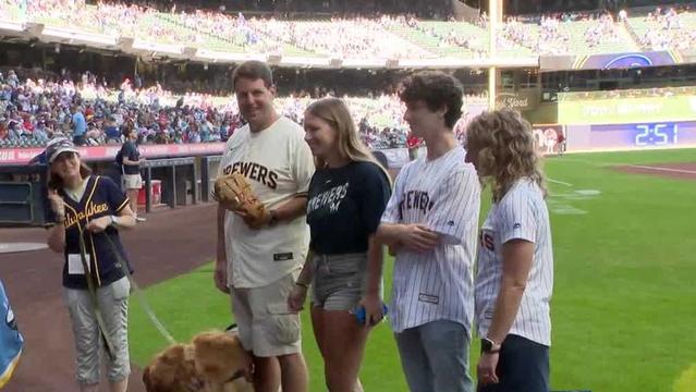Brewers surprise first responder with service dog