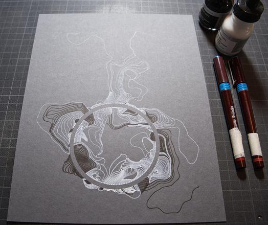The same flowing design with lines radiating away from a circle in organic forms. Printed with a pen plotter on dark cardboard in two rounds, first black india ink and then white ink on top, with me lifting the pen away manually to get areas without white.
Lying on a work cuttingboard with a alignment grid. We also see two Rapidograph pens and two ink bottles.