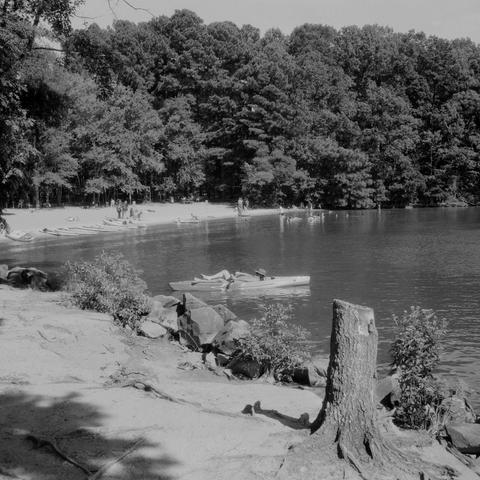 A man floating in a kayak, leaned back and reclined.  A beach with swimmers and other people playing in the lake behind him.

Mamiya 6 IV | Kentmere 200

Home developed in Rodinal 1+25 | 8:30 @ 22 C | Rotation