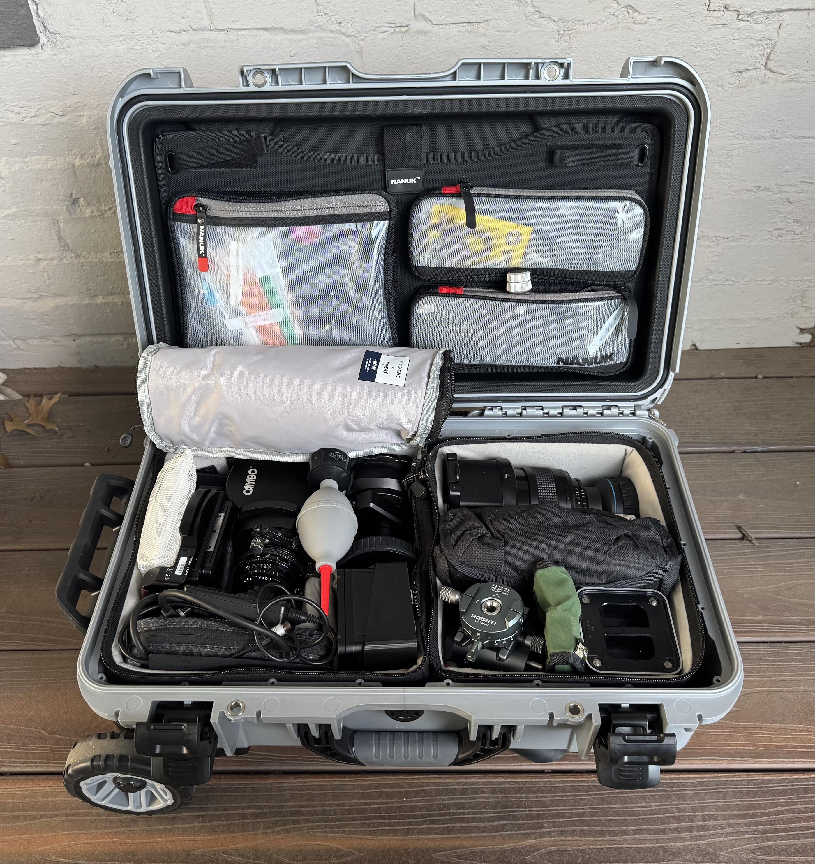 Inside my Nanuk rolling case. A bunch of photo gear, packed like very expensive sardines.