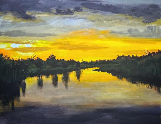 A painting of a sunset over a body of water surrounded by vegetation. A vibrant yellow orange sky with gray purplish clouds is reflected in the water below.
