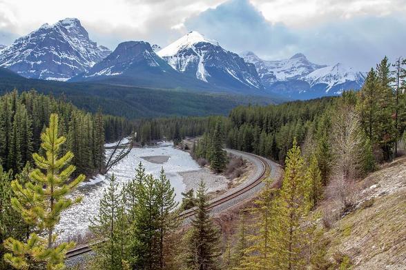 View of Morant's Curve in Banff National Park, featuring a winding railway and stunning mountain landscape.