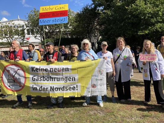 Protestors hold a sign in German protesting new gas drilling in the North Sea