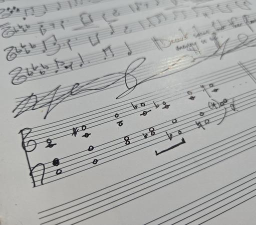 Handwritten music in a notebook.