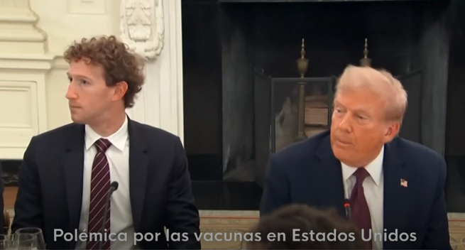 Screen capture from a television channel displaying Mark Zuckerberg (owner of Meta/Facebook) sitting at US president Donald Trump's table in case the orange buffoon's shoes needs polishing.
