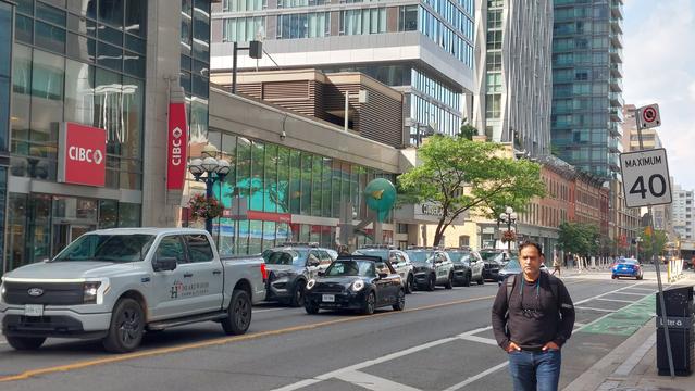 Row of cop cars at Yonge and Bloor for the weekly protest.