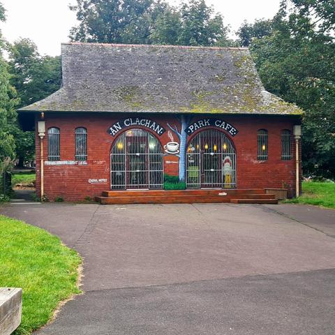 A small brick-built building with a pair of arched entrances and a high-pitched roof.