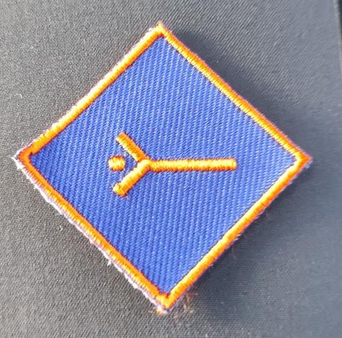 Pfadfindersymbol für "Wölflinge entdecken die Welt"