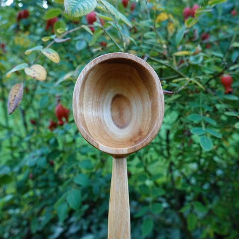 Bowl of a wooden scoop.