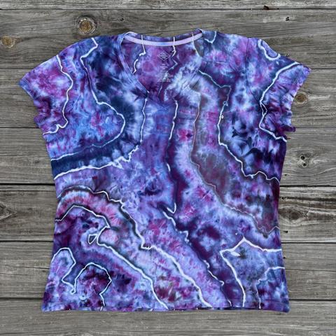 Front side of a geode tied shirt dyed in shades of purple. There are blue and pink splits included.