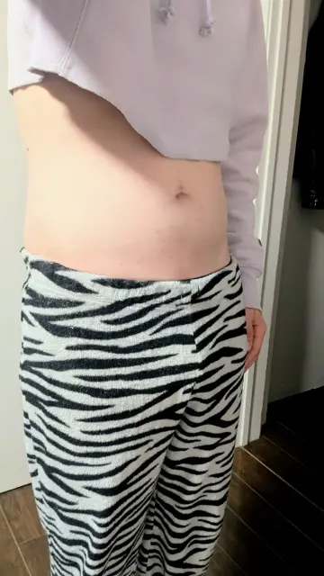 My soft, smooth, belly, exposed by my light purple cropped hoodie, begs for some strong, rough hands to feel it. 
Work your hands down to remove my zebra print pajama pants. What lays beneath?
Though only a slight bulge shows, expose what is hidden behind the pants. Cradle my balls, play with my piercings. My body wishes to feel your hands on it.
I want to feel your body on mine, don't be gentle.