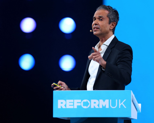 Photo Aseem Malhotra at the podium Caption Aseem Malhotra drew gasps from the audience in Birmingham when he made the claim.