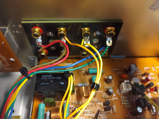 Inside view of the newly installed terminals. The wires running to the posts are in rainbow colors.