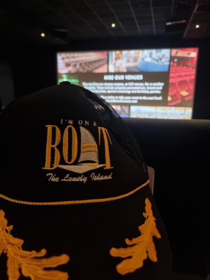 The Lonely Island themed baseball cap, with an I'm on a Boat caption and a very appropriate sail on it, in a Curzon cinema just before a screening of The Roses.