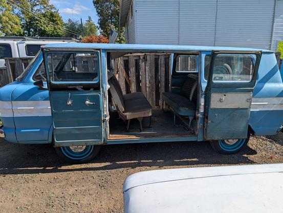 an 8 door 63' chevrolet greenbrier with both side doors open