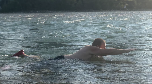 Me swimming in the river, supporting myself with one hand while the rest of my body might look vaguely like I were flying if you looked at it through silly glasses
