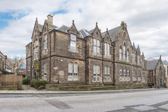 The former Canonmills School. The building to the right is the Elsie Clark Halls, which includes the original St Mary's School building to its rear. Note the ESB roundel on the principal gable in the centre of the building. Picture via S1 Developments.