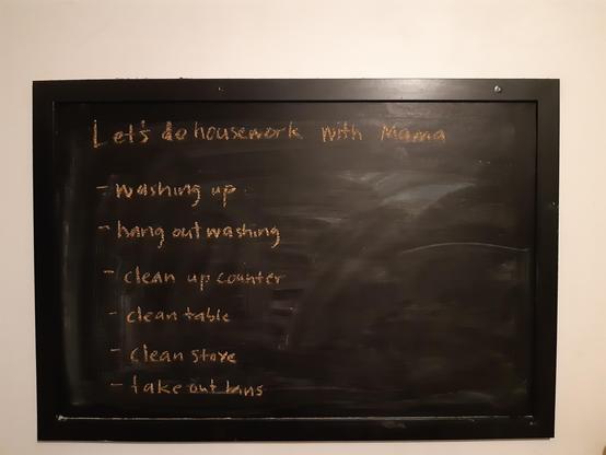 Our kitchen blackboard on which I've written the words: Let's do housework with Mama

Beneath are the tasks I want them to do: 
Washing up; hang out washing; clean up counter; clean table; clean stove; take out bins
