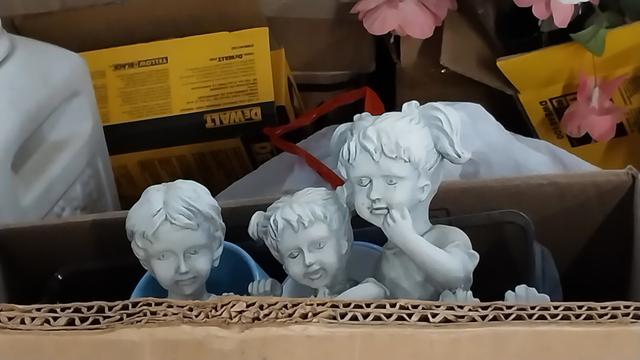 Creepy lawn statues of creepy little children