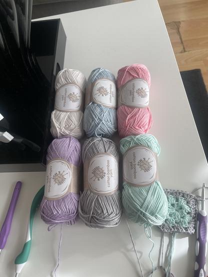 yarn in white, light blue, light pink, light purple, gray and mint green